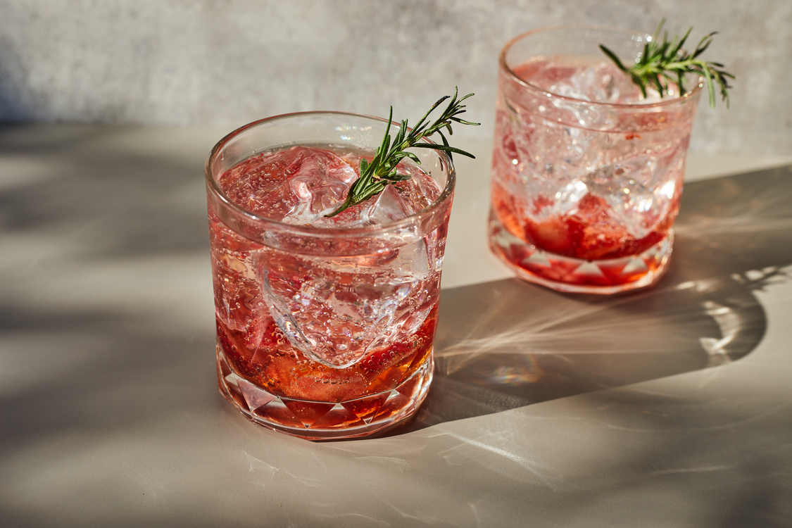 Holiday cold sparkling drink for party with ripe strawberry.
